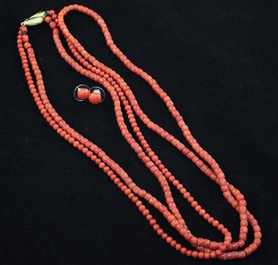 Two single strand coral bead necklaces and a pair of coral bead earrings, gross weight 49 grams.